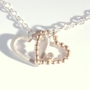 Silver and gold heart pendant