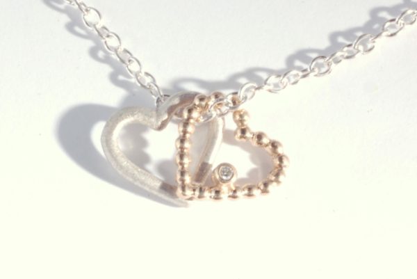 Silver and gold heart pendant